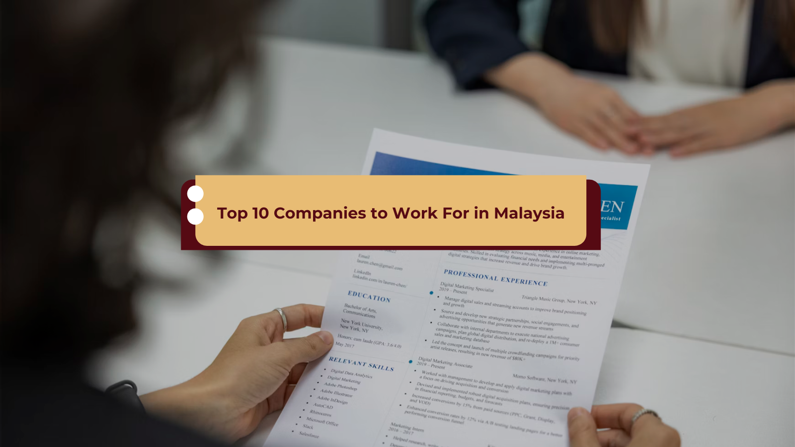 woman holding resume at job interview